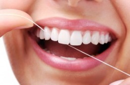 Beautiful-Smile-With-Dental-Floss-iStock_000020235113Small-300x199